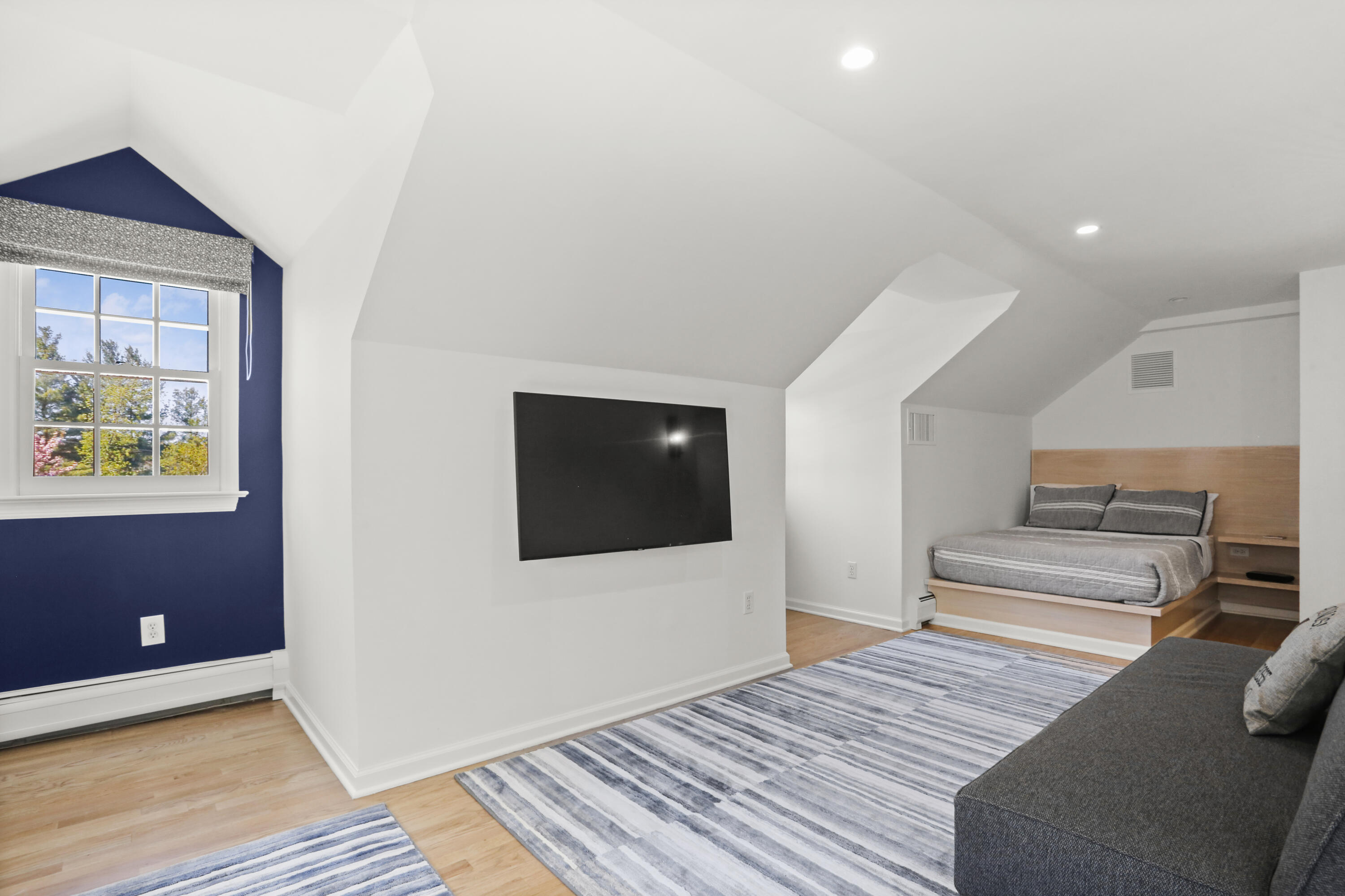 10 Saddle Ridge Road Darien, CT 06820 - Photo 23 of 41 a bedroom with furniture and a flat screen tv