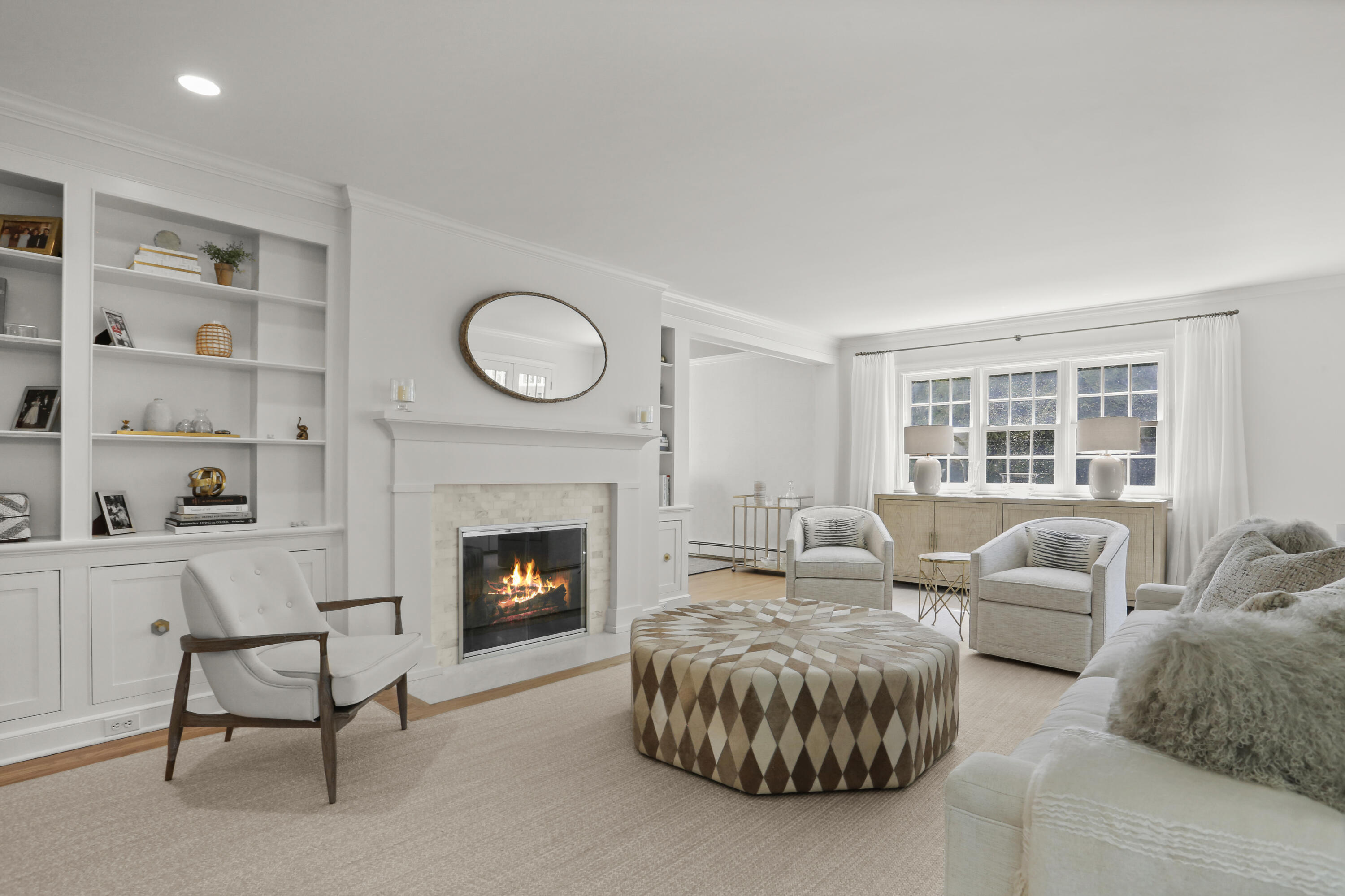 10 Saddle Ridge Road Darien, CT 06820 - Photo 3 of 41 a living room with furniture and a fireplace