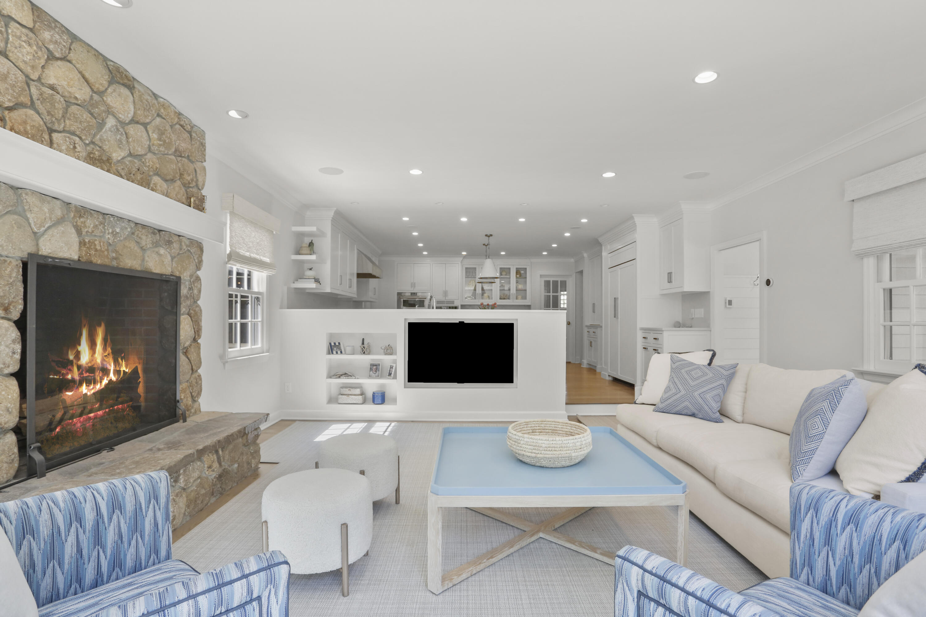 10 Saddle Ridge Road Darien, CT 06820 - Photo 6 of 41 a living room with furniture a fireplace and a flat screen tv