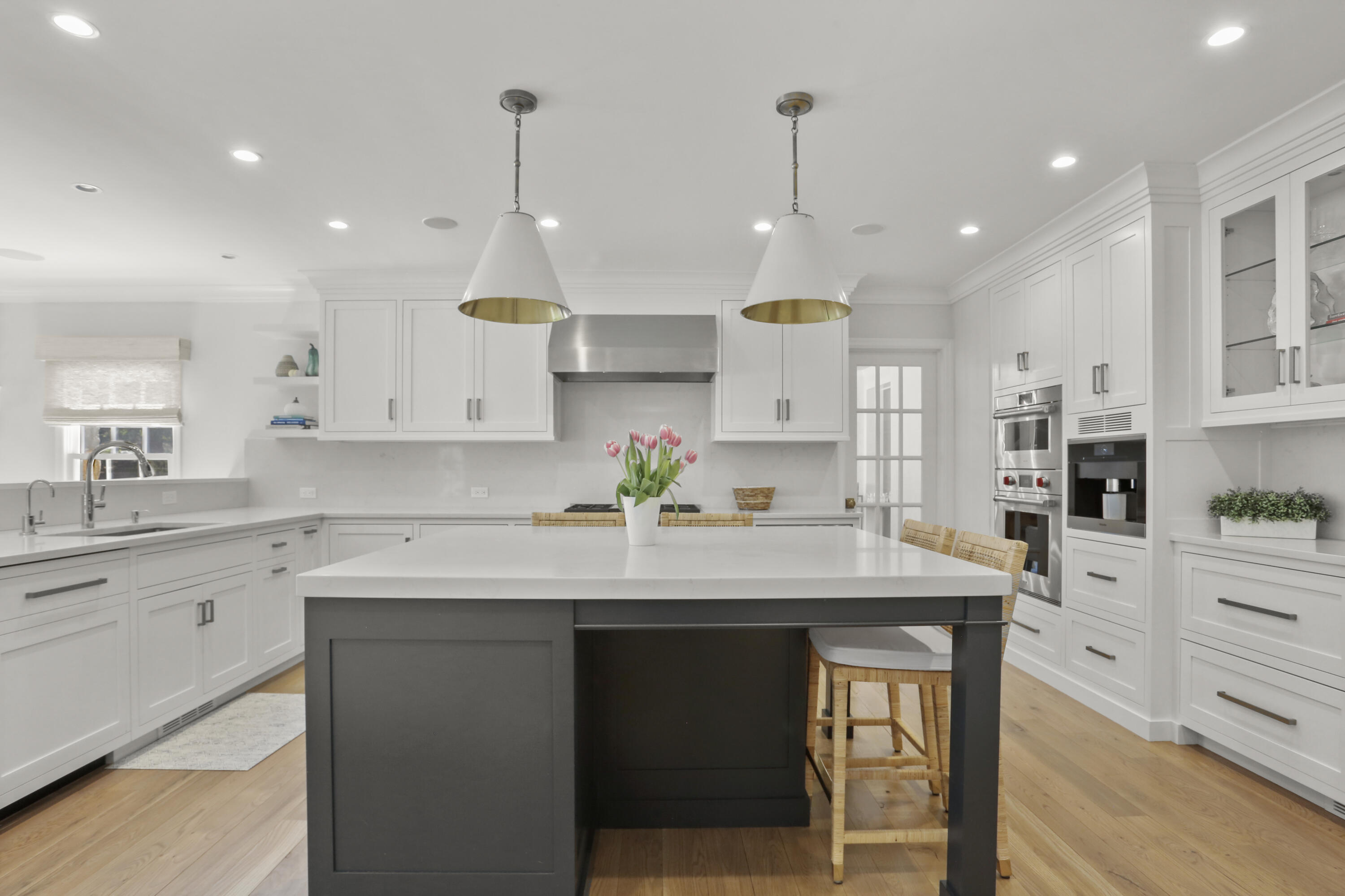 10 Saddle Ridge Road Darien, CT 06820 - Photo 9 of 41 a kitchen with kitchen island granite countertop a sink a center island and cabinets