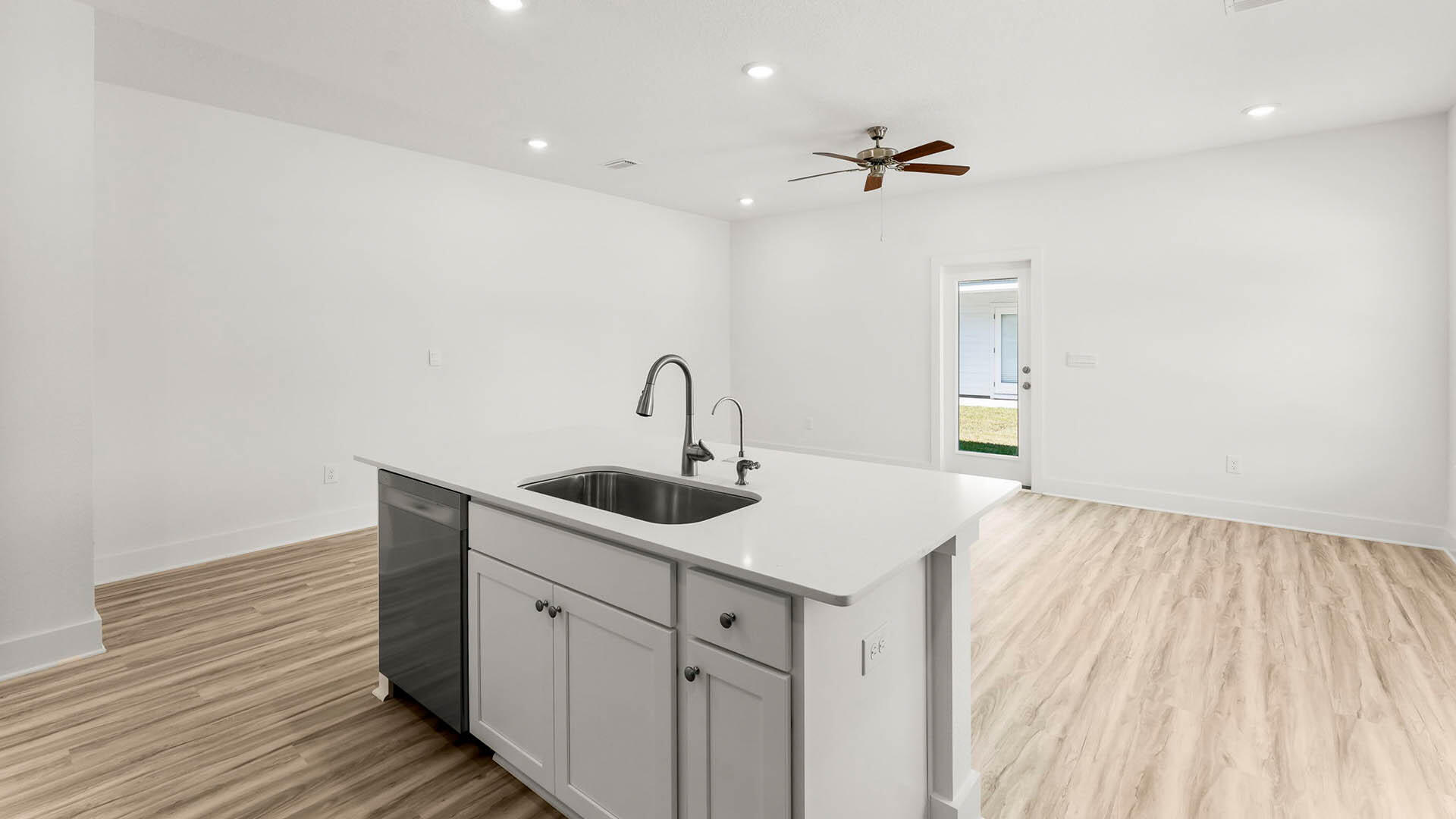 137 Hawk Street Santa Rosa Beach, FL 32459 - Photo 12 of 30 a kitchen with a sink and cabinets