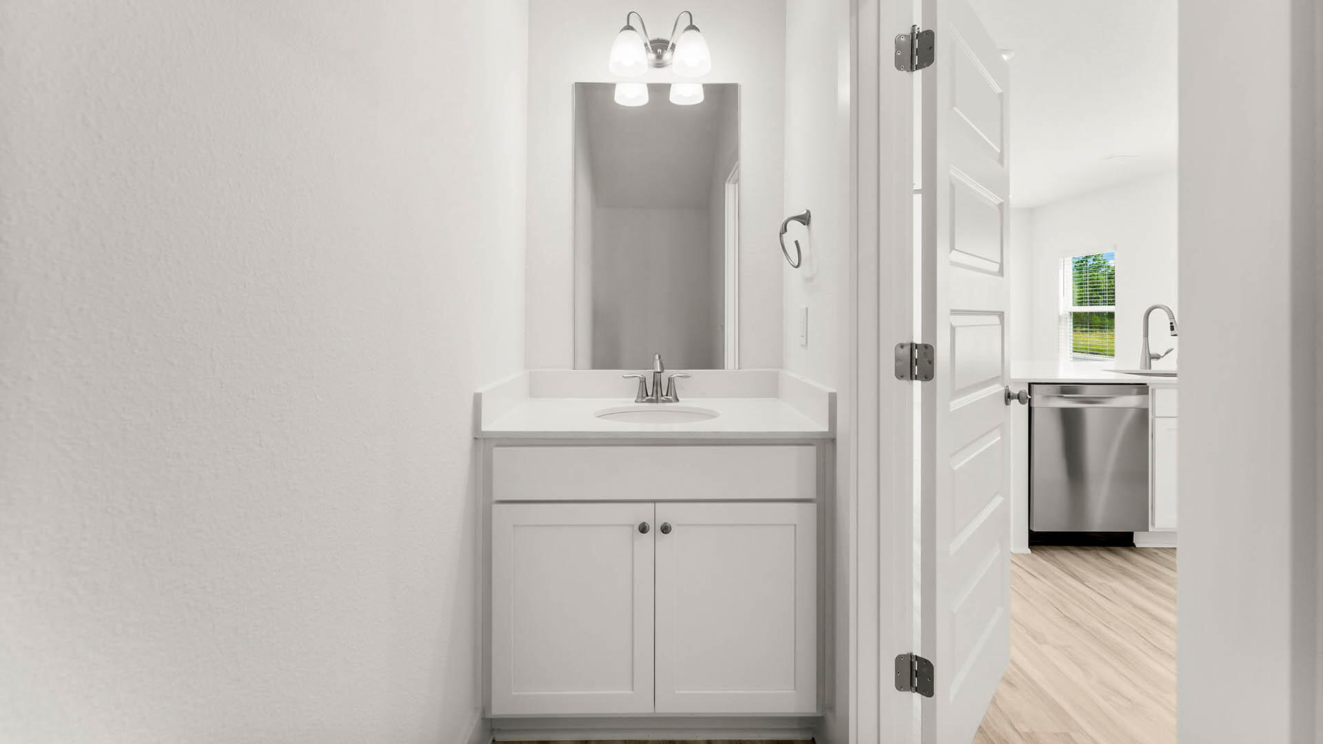 137 Hawk Street Santa Rosa Beach, FL 32459 - Photo 15 of 30 a bathroom with a sink a mirror and a shower