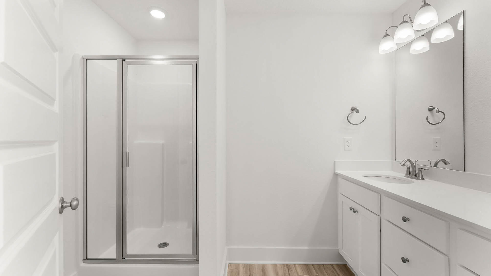 137 Hawk Street Santa Rosa Beach, FL 32459 - Photo 21 of 30 a bathroom with a shower a sink and a mirror
