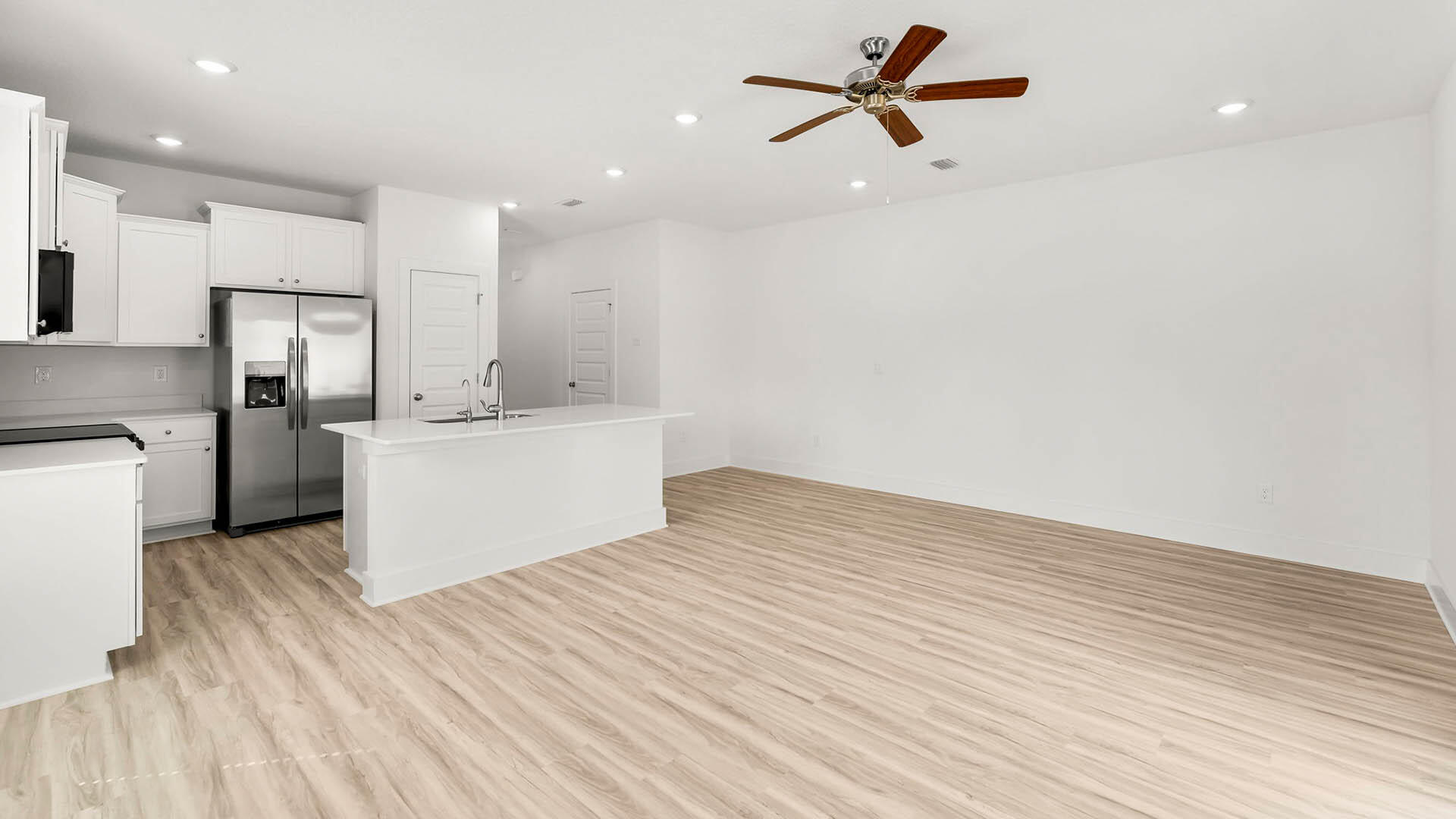 137 Hawk Street Santa Rosa Beach, FL 32459 - Photo 9 of 30 a view of a kitchen with a sink and wooden floor