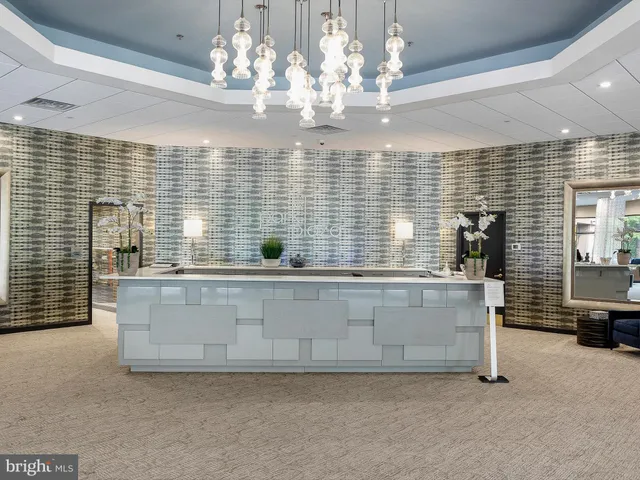 a view of kitchen with granite countertop cabinets