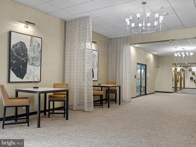 a view of a livingroom with furniture and a chandelier