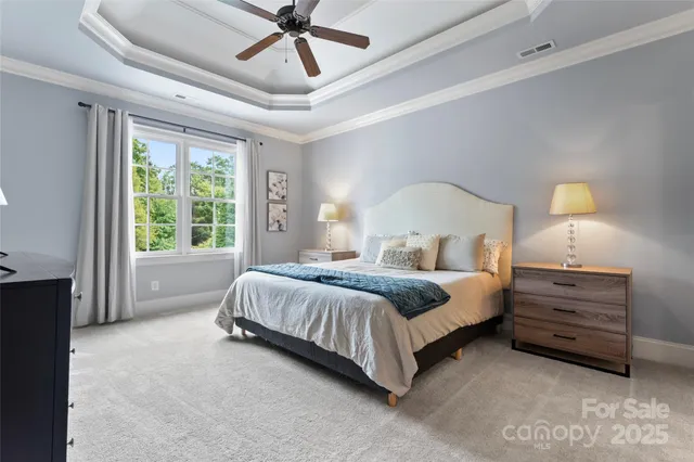 a bedroom with bed and window