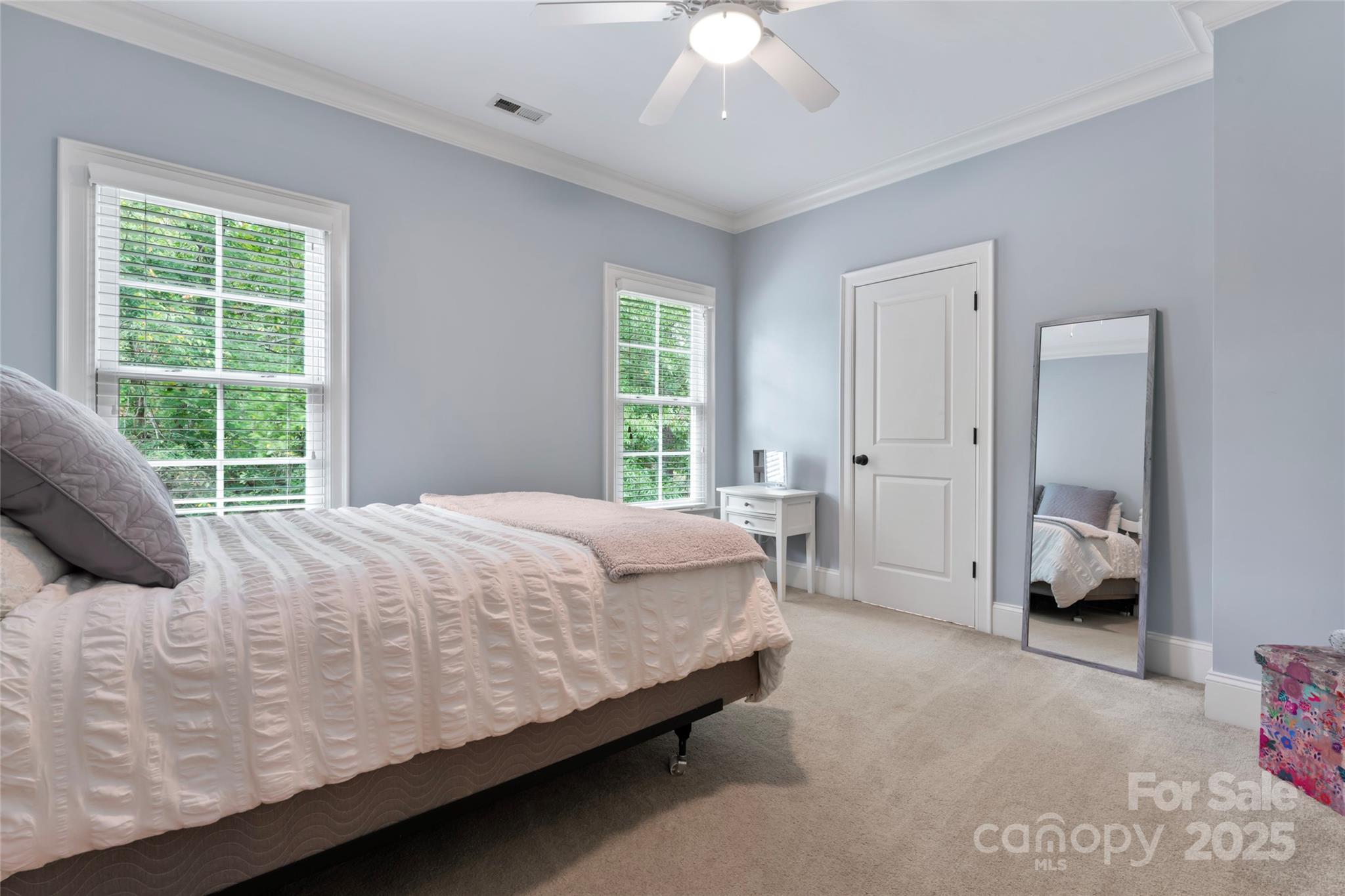 235 Grey Road Davidson, NC 28036 - Photo 20 of 37 a bed sitting in a bedroom next to a window