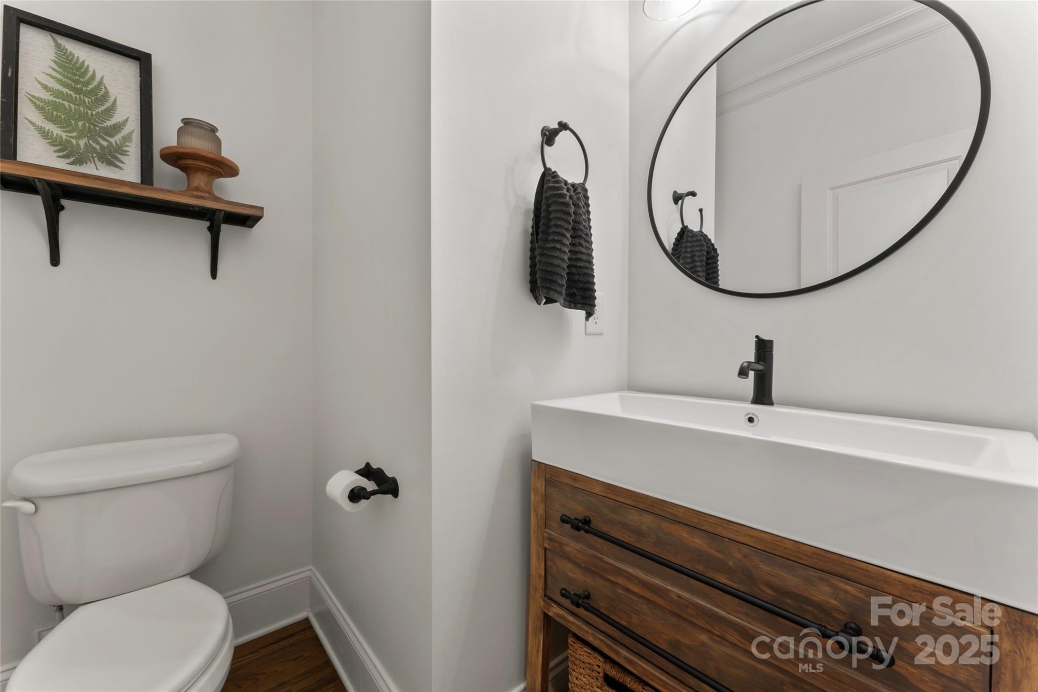 235 Grey Road Davidson, NC 28036 - Photo 23 of 37 a bathroom with a sink mirror and toilet