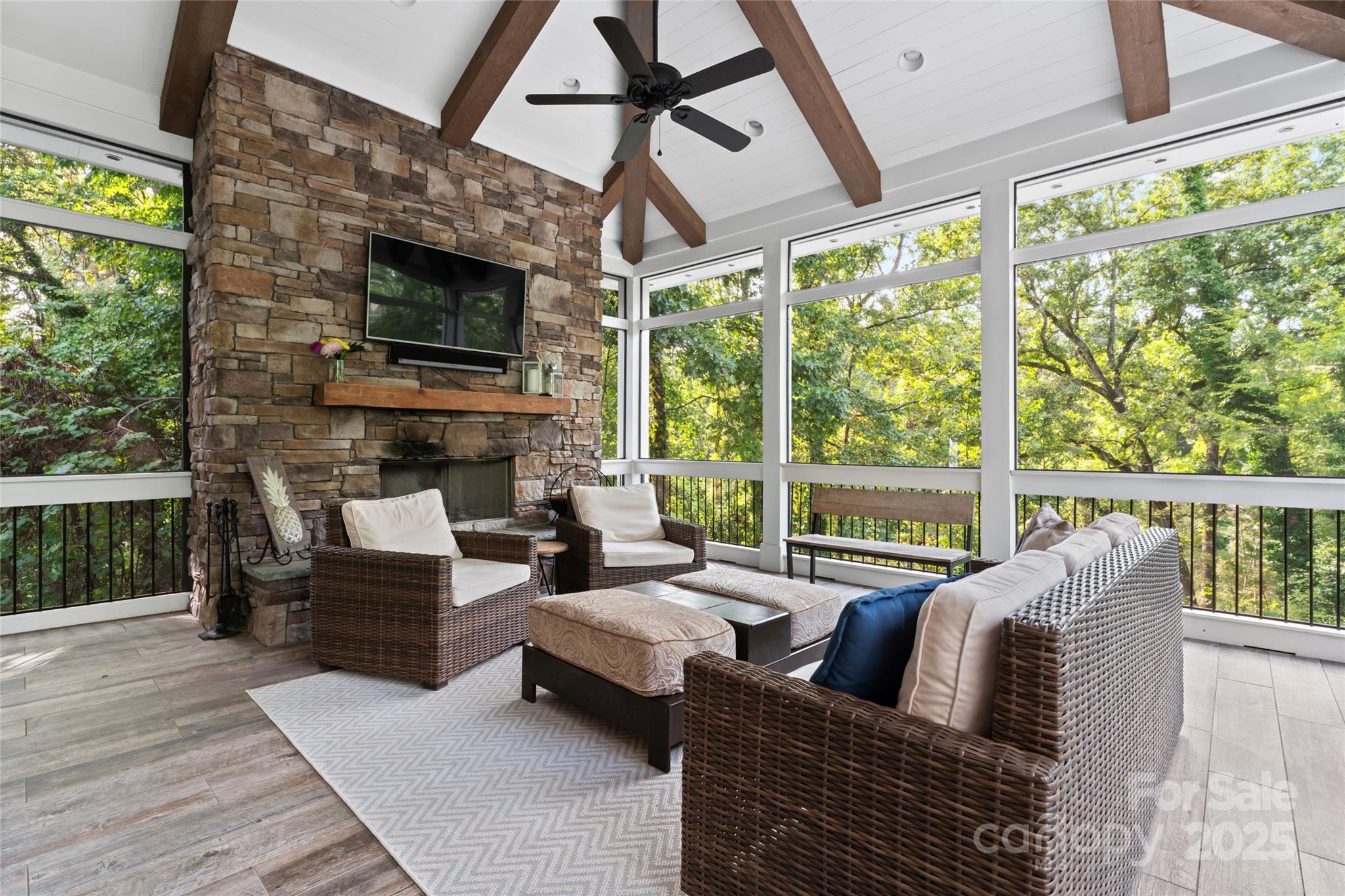 235 Grey Road Davidson, NC 28036 - Photo 25 of 37 a living room with fireplace furniture and a flat screen tv