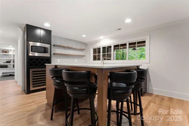 a kitchen with a table and chairs in it