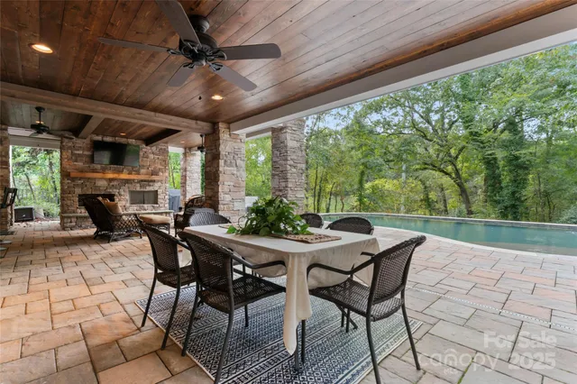 a view of a patio with a table and chairs