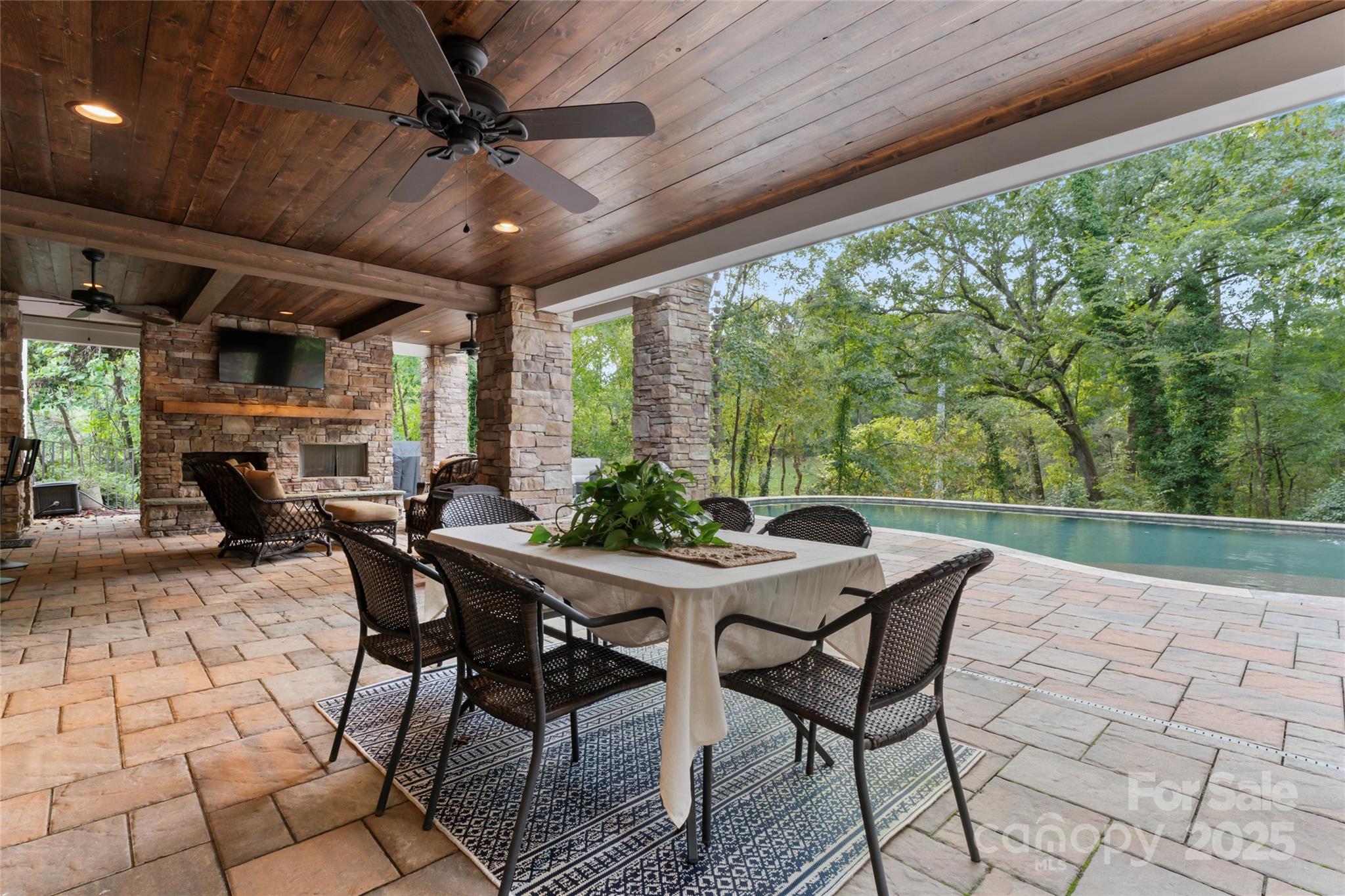 235 Grey Road Davidson, NC 28036 - Photo 32 of 37 a view of a patio with a table and chairs