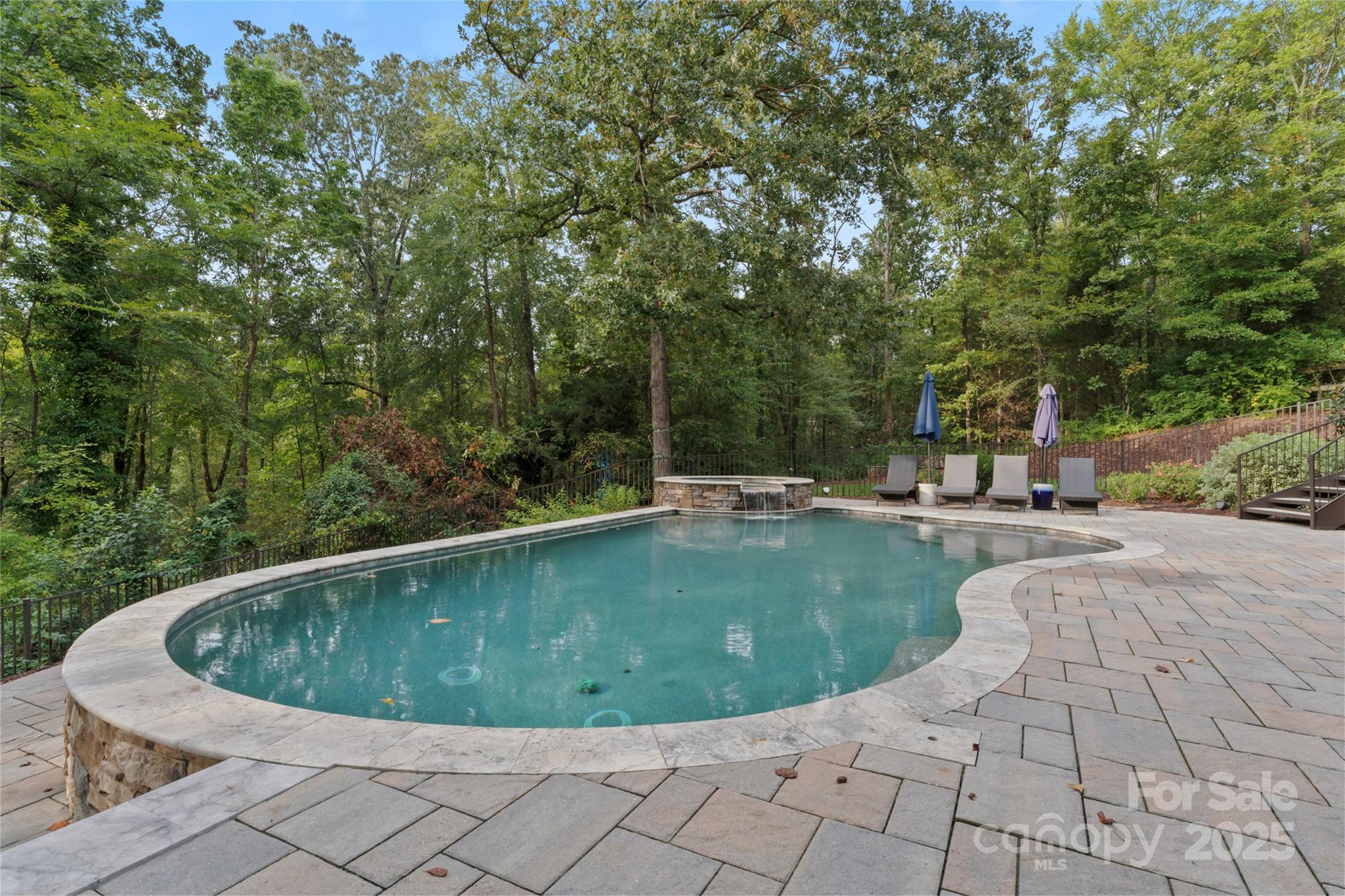 235 Grey Road Davidson, NC 28036 - Photo 34 of 37 a view of a swimming pool with a yard