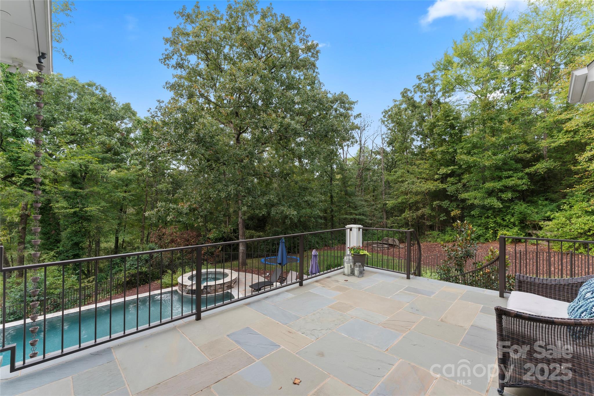 235 Grey Road Davidson, NC 28036 - Photo 35 of 37 a view of a roof deck with wooden fence and trees