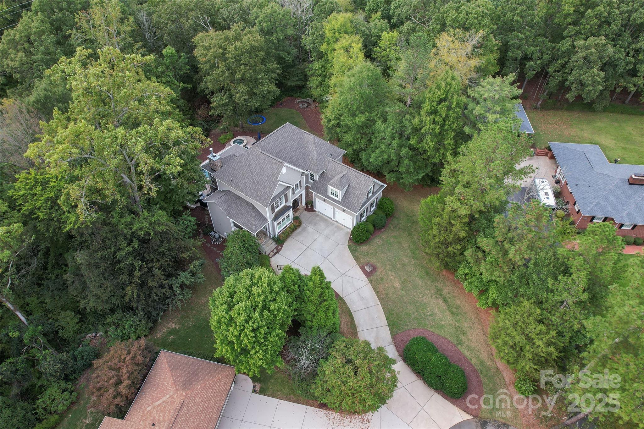 235 Grey Road Davidson, NC 28036 - Photo 36 of 37 an aerial view of a house with a yard and lake view