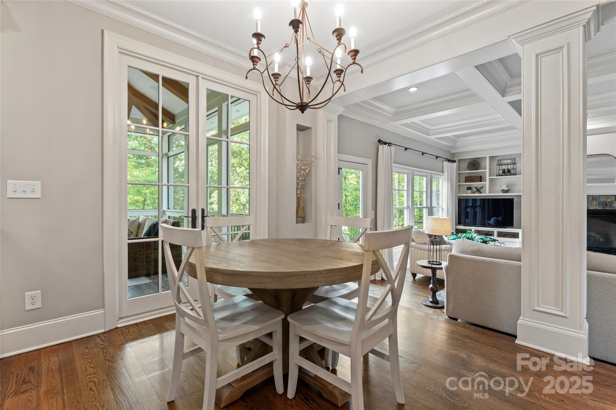 235 Grey Road Davidson, NC 28036 - Photo 6 of 37 a view of a dining room with furniture a chandelier and wooden floor