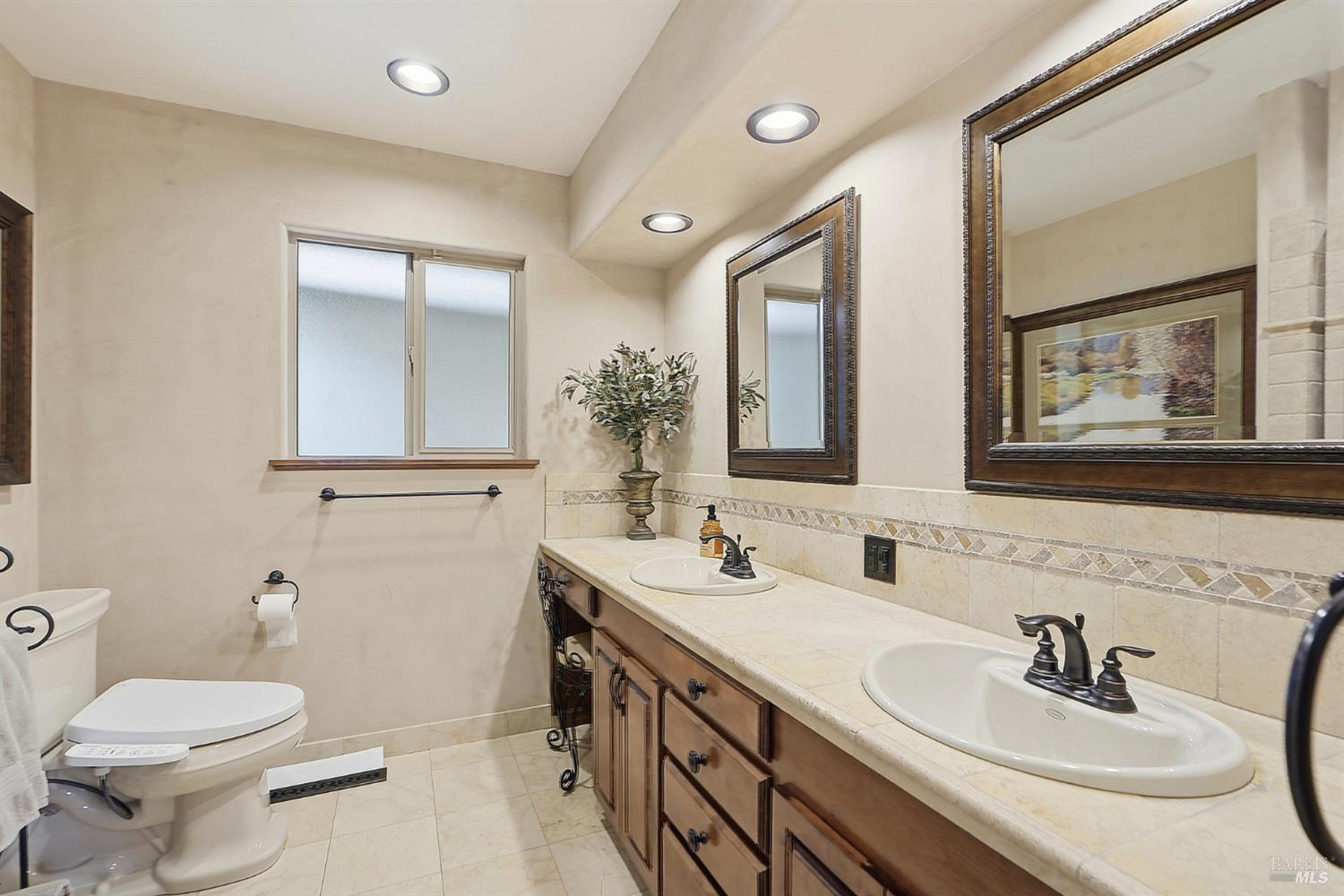 373 Piezzi Road Santa Rosa, CA 95401 - Photo 21 of 55 a bathroom with a sink and a mirror