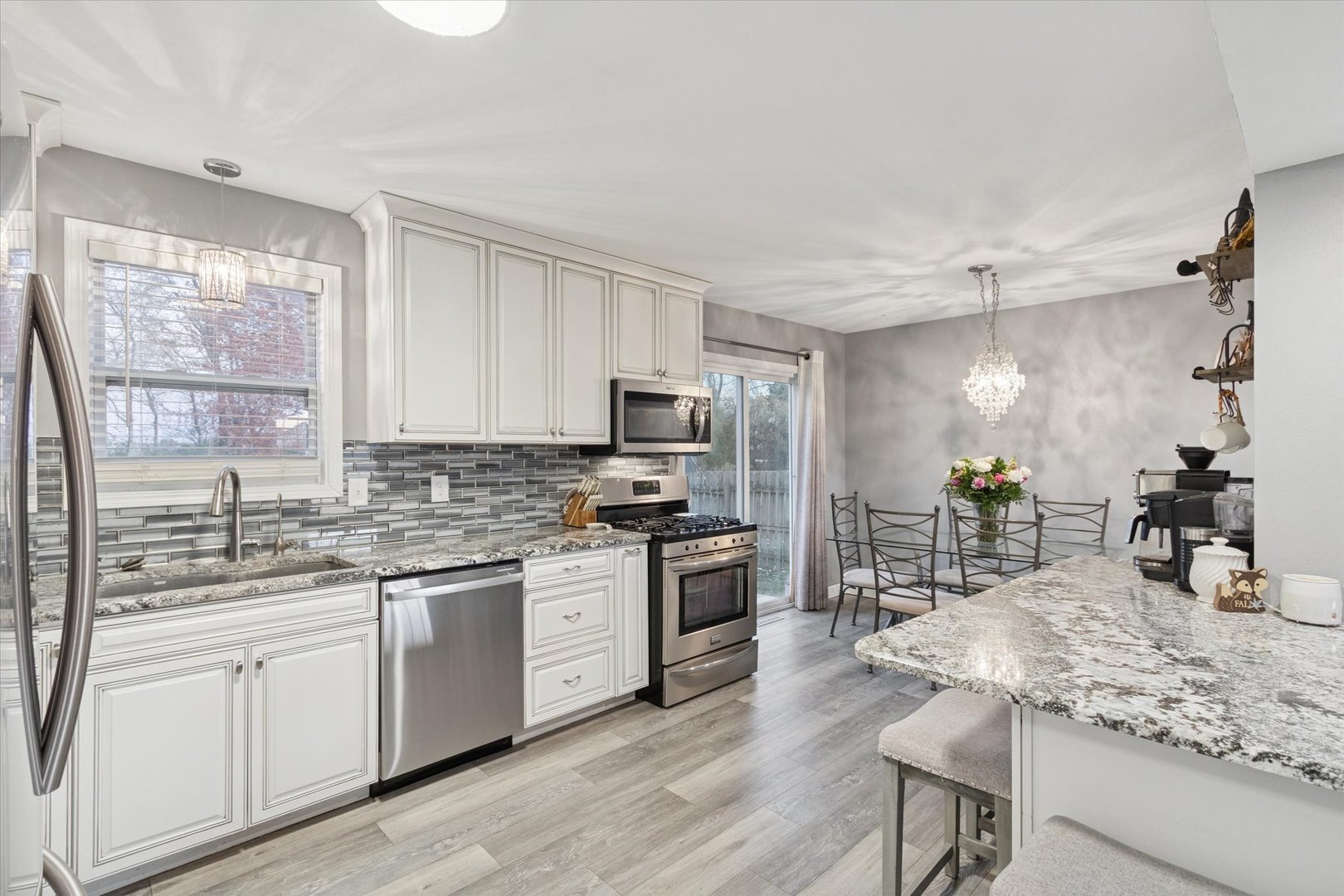 549 Bayfield Road Rockton, IL 61073 - Photo 11 of 42 a kitchen with a sink stove and refrigerator