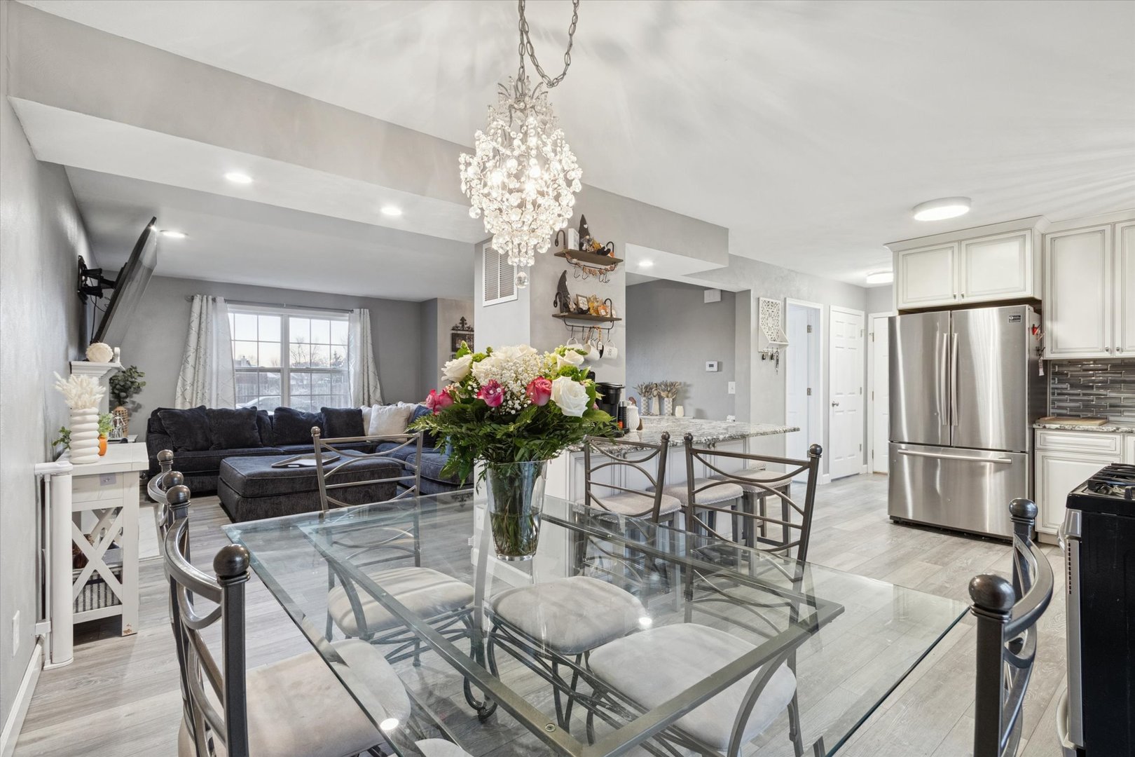 549 Bayfield Road Rockton, IL 61073 - Photo 13 of 42 a view of a dining room with furniture and a chandelier