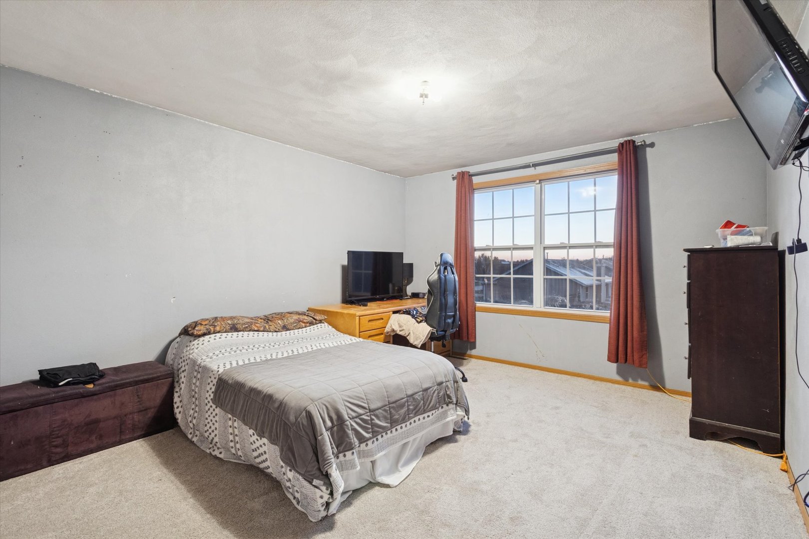 549 Bayfield Road Rockton, IL 61073 - Photo 23 of 42 a bedroom with a bed and a flat tv screen on the dresser