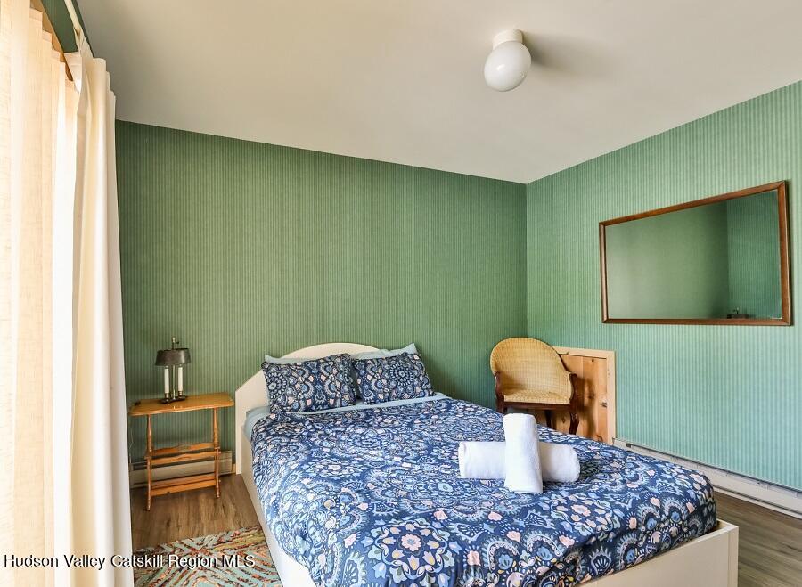 111 Brainard Ridge Road, Unit 11B Windham, NY 12496 - Photo 13 of 18 a room with a table and potted plant