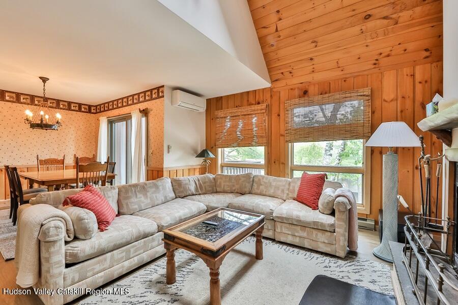 111 Brainard Ridge Road, Unit 11B Windham, NY 12496 - Photo 3 of 18 a living room with furniture a ceiling fan and a window