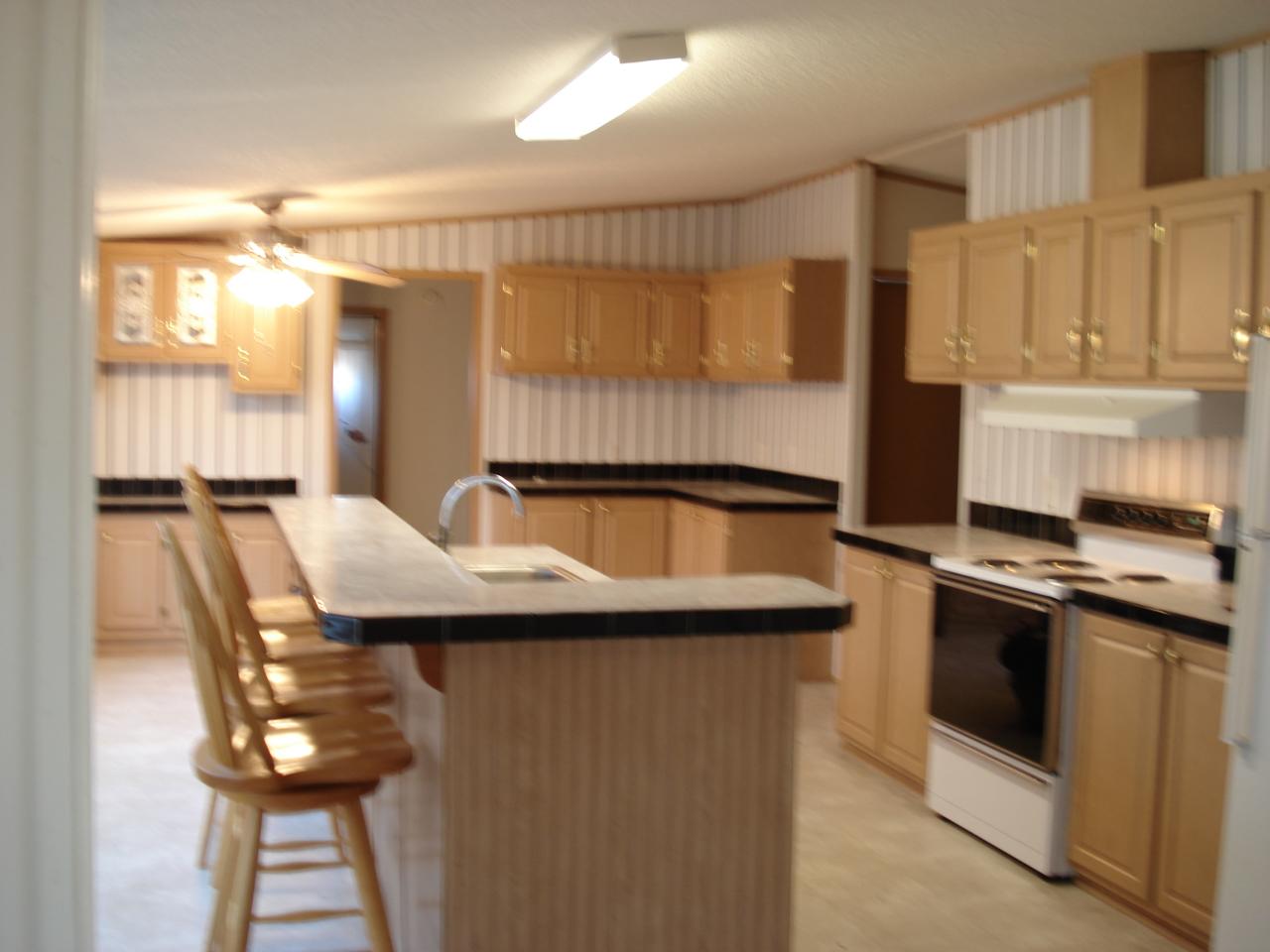 2015 Lick Ridge Road Northeast Check, VA 24072 - Photo 3 of 10 a kitchen with a sink and chairs