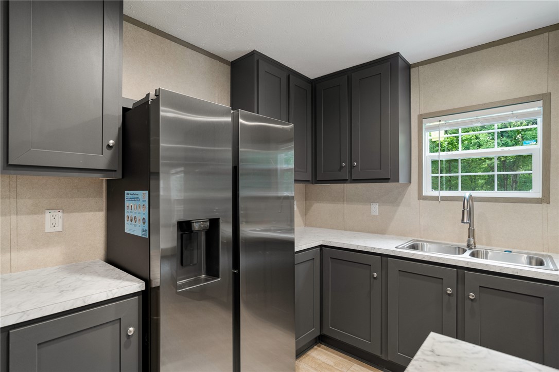 419 Austin Drive Anderson, SC 29624 - Photo 16 of 36 This modern kitchen features sleek cabinetry, stainless steel appliances, and ample counter space for culinary endeavors.