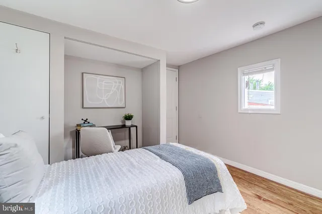 a bedroom with bed and window