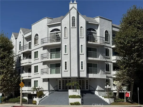 a front view of a building with street view