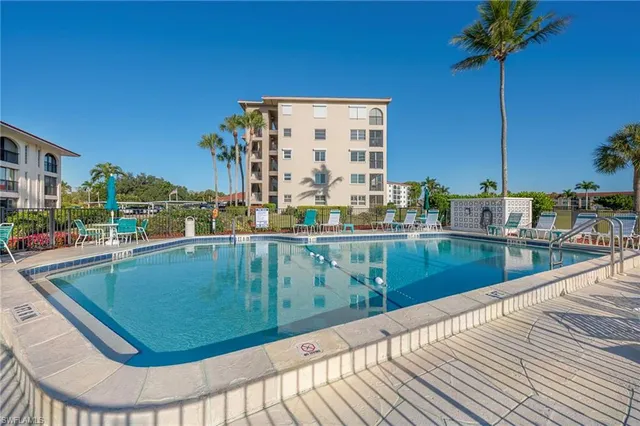 a view of a swimming pool with a patio