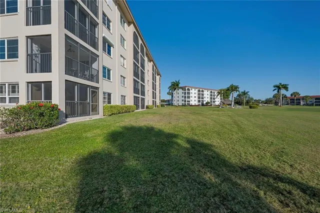 a view of a building next to a big yard