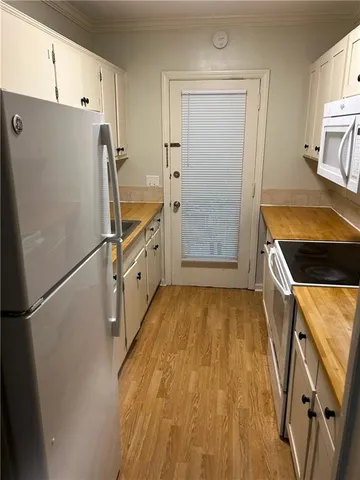 a kitchen with a refrigerator a sink and dishwasher