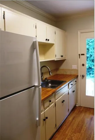 a view of a kitchen with electric appliances