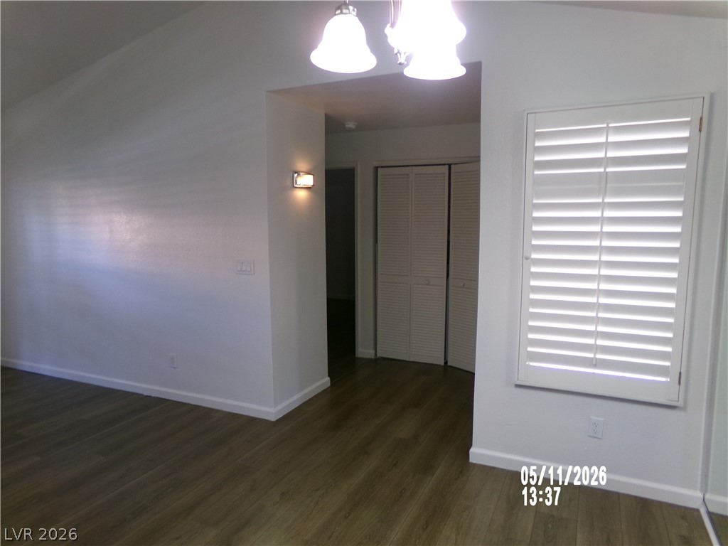 2995 East Sunset Road, Unit 222 Las Vegas, NV 89120 - Photo 15 of 29 Bright interior features warm wood flooring and shuttered windows.