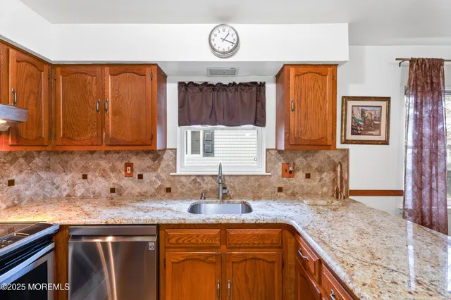 a view of a livingroom with wooden floor and a window