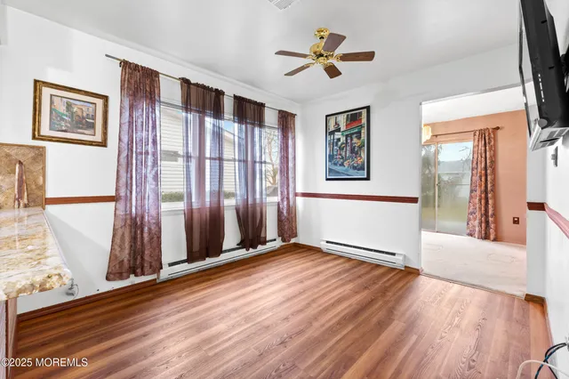 a kitchen with stainless steel appliances granite countertop a sink stove and wooden floor