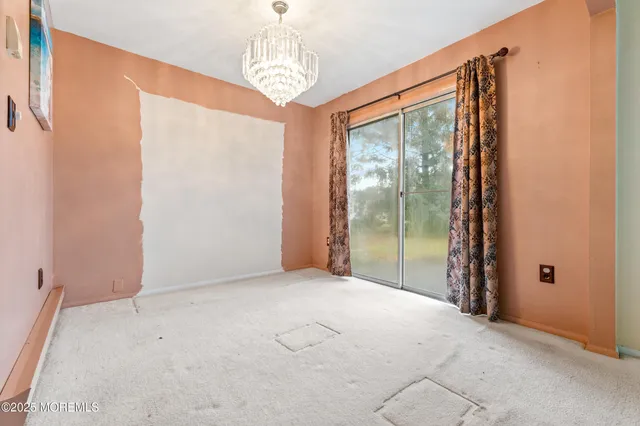 a view of an empty room with windows