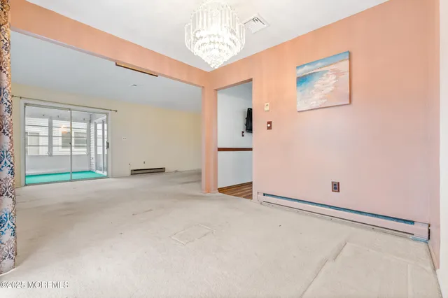 a kitchen with stainless steel appliances granite countertop a refrigerator a stove and a wooden floors