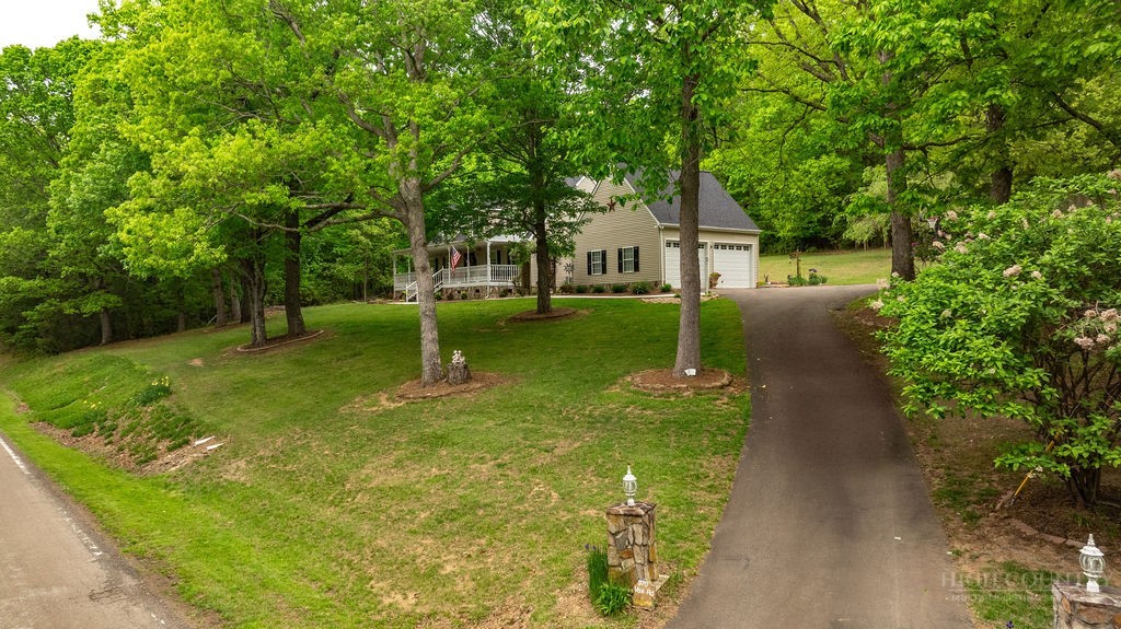 970 Vox Road Sparta, NC 28675 - Photo 8 of 50 a house with a tree in front of it