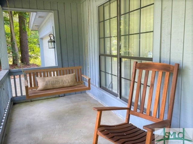 21 Quail Road Richmond Hill, GA 31324 - Photo 2 of 20 Rocking chair front porch