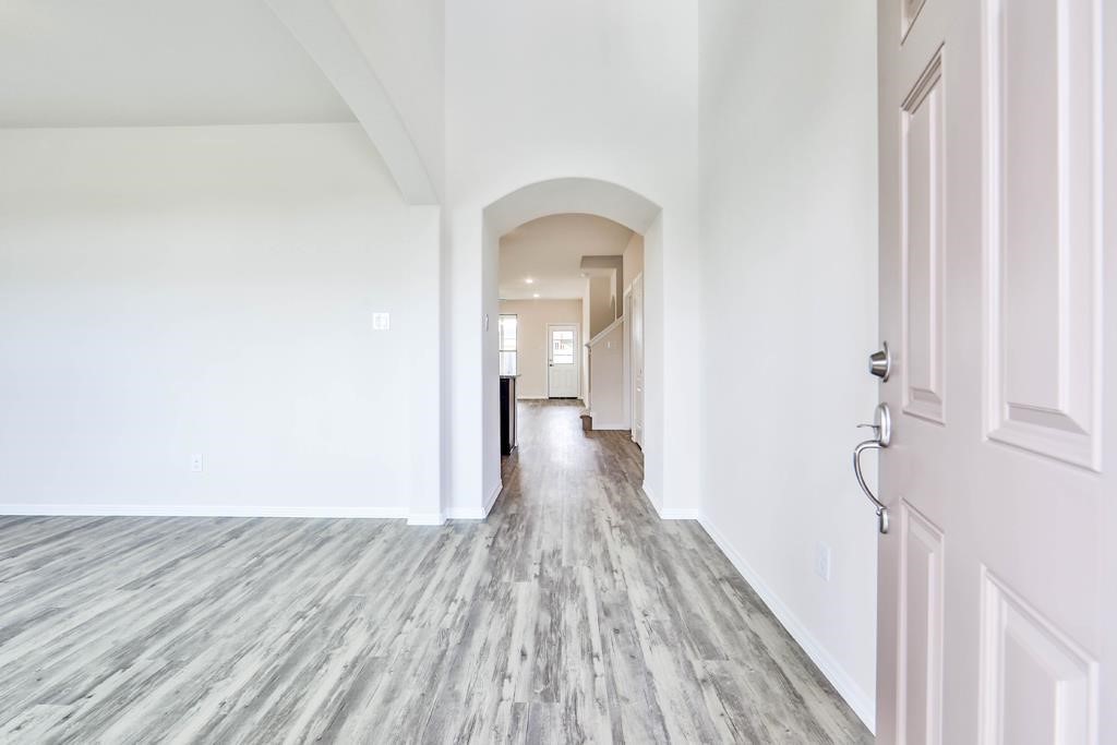 247 Sintra Lk Way Rosenberg, TX 77469 - Photo 2 of 28 a view of a room with wooden floor
