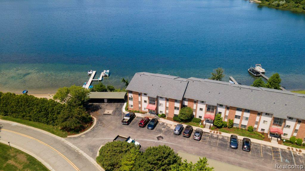 1974 Klingensmith Road, Unit 4 Bloomfield Hills, MI 48302 - Photo 33 of 35 Waterfront multi-story building featuring brick and siding facade