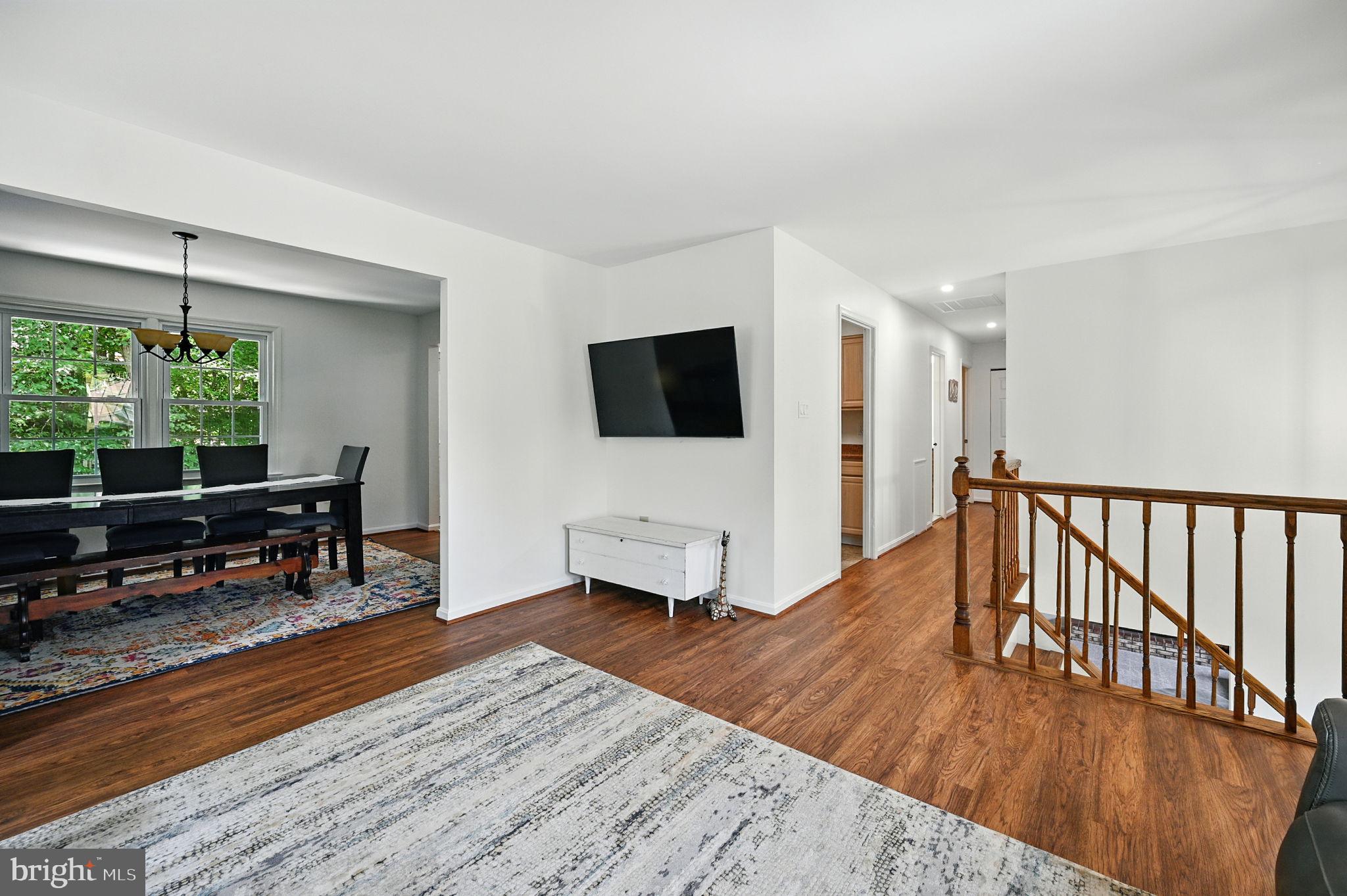 8923 Renshaw Court Springfield, VA 22153 - Photo 13 of 38 a living room with furniture and a flat screen tv