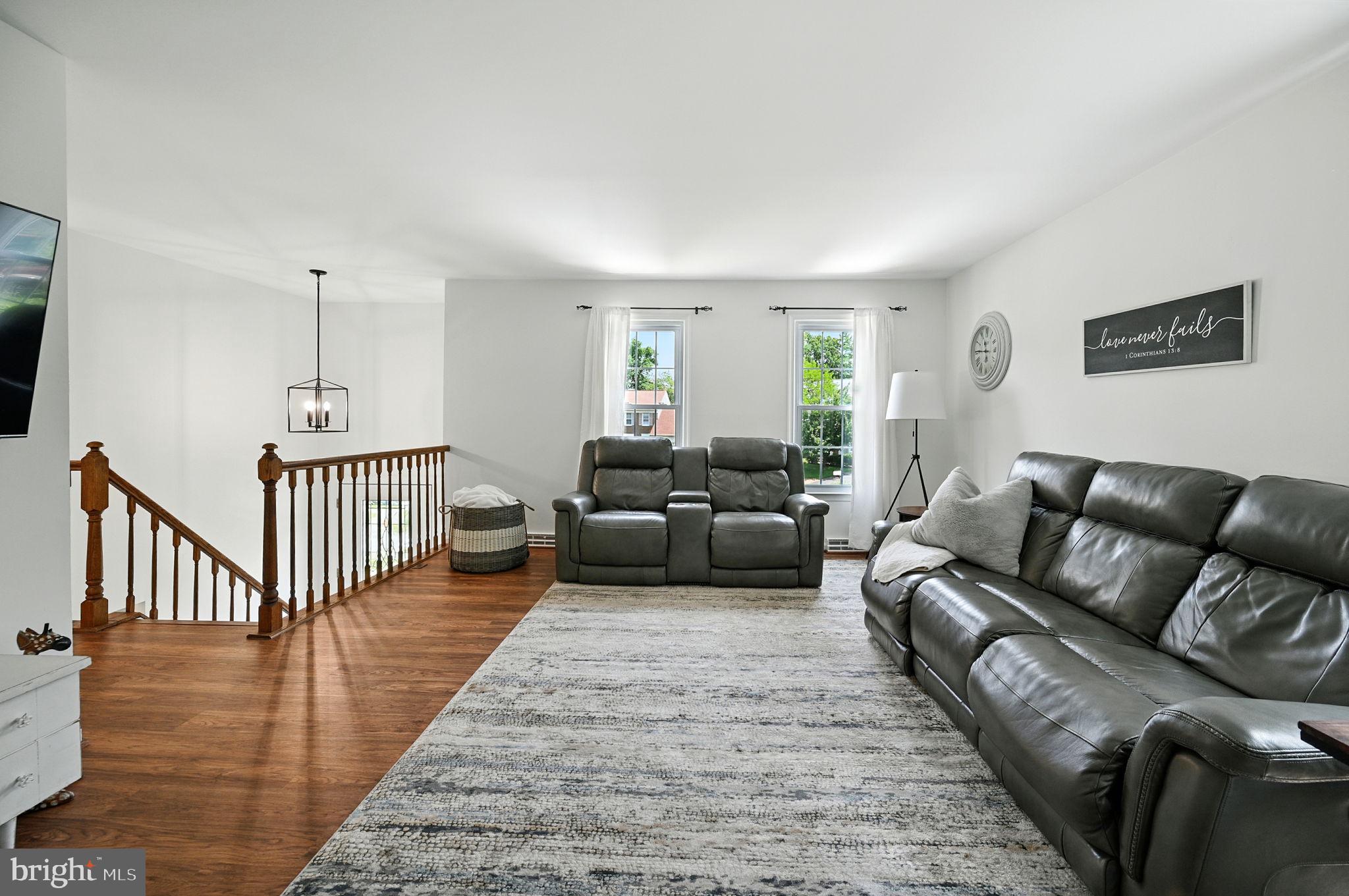 8923 Renshaw Court Springfield, VA 22153 - Photo 15 of 38 a living room with furniture or couch and a wooden floor