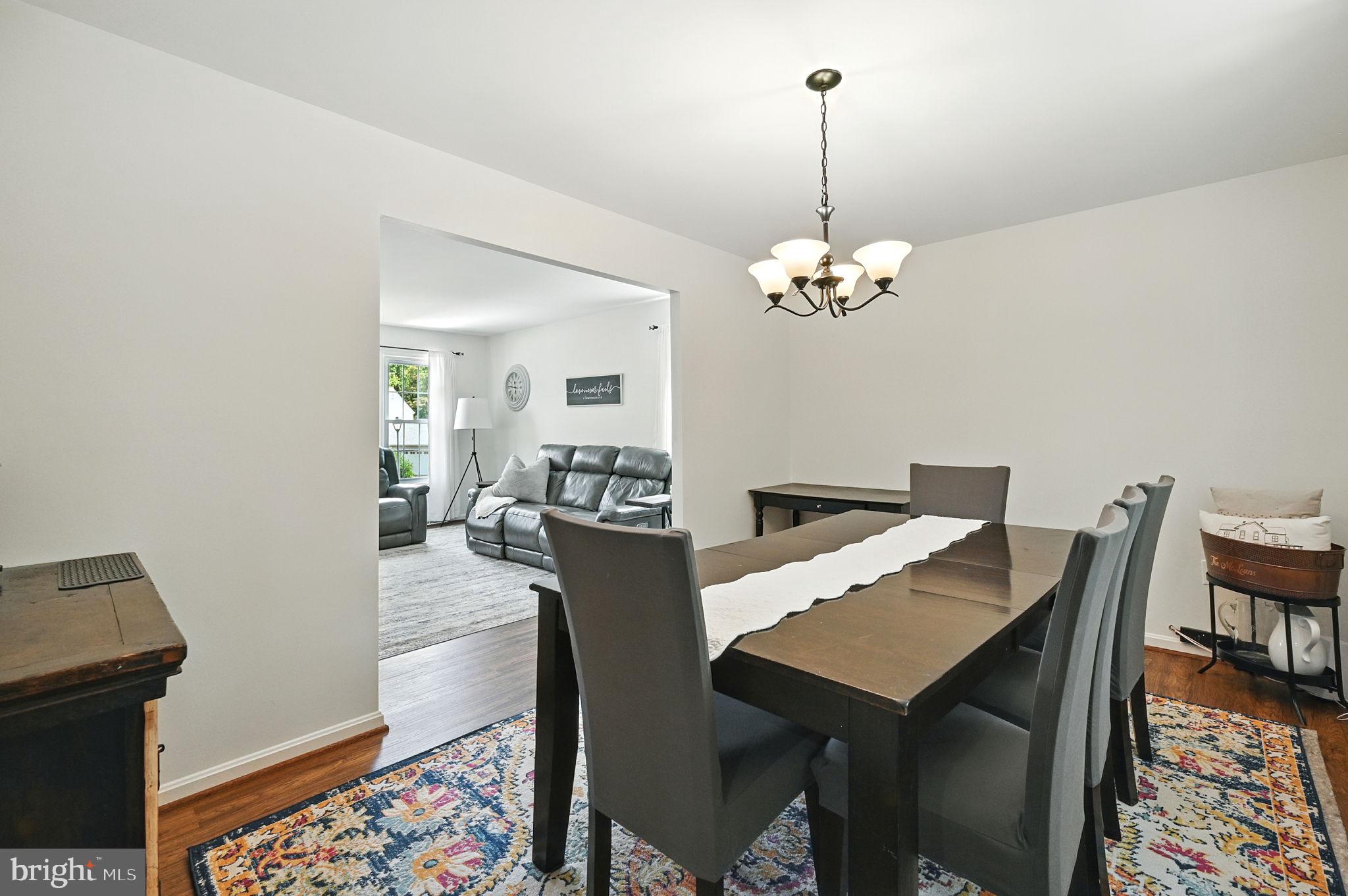 8923 Renshaw Court Springfield, VA 22153 - Photo 16 of 38 a view of a dining room with furniture and wooden floor
