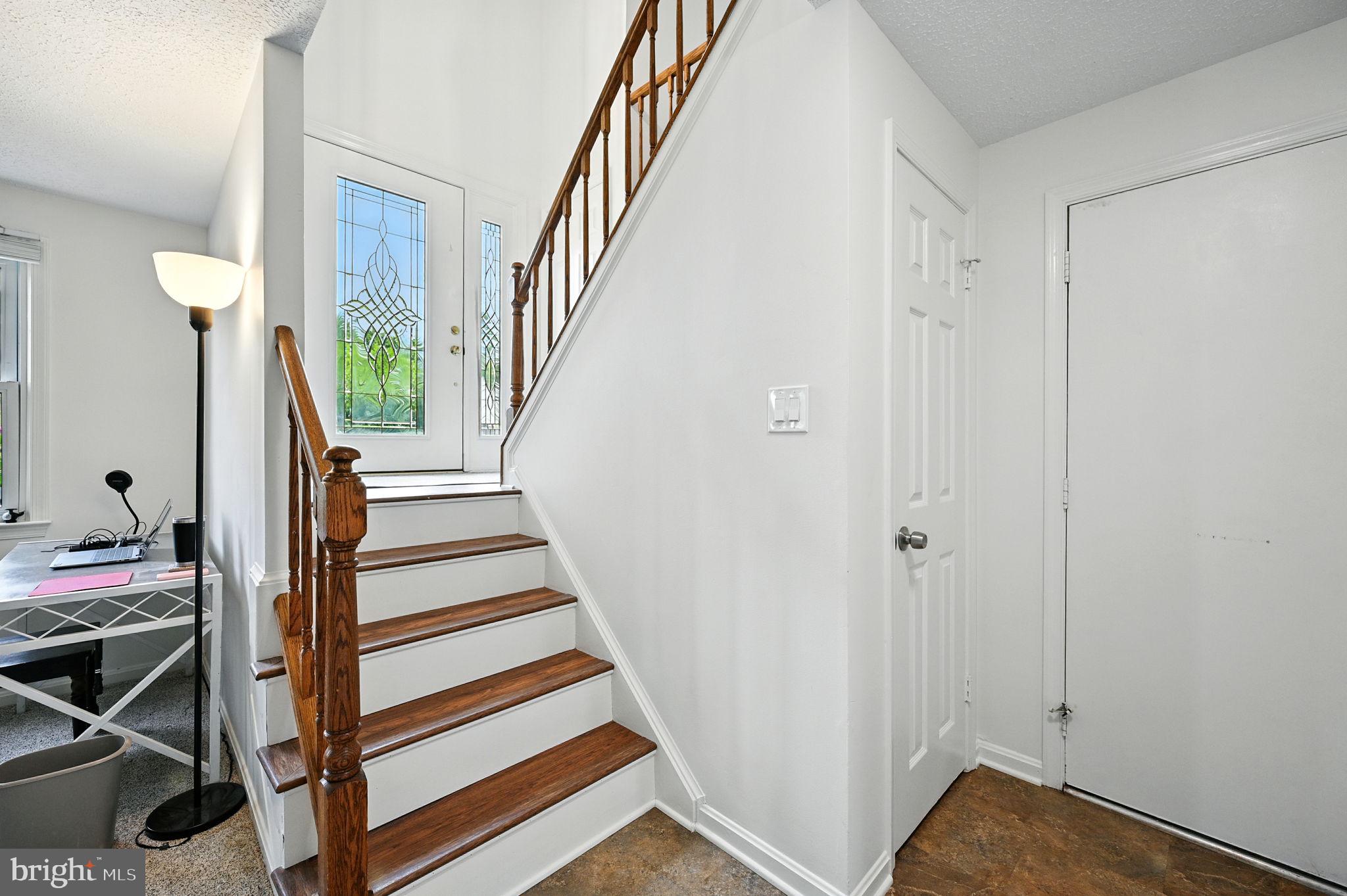 8923 Renshaw Court Springfield, VA 22153 - Photo 3 of 38 a view of entryway with wooden floor and stairs