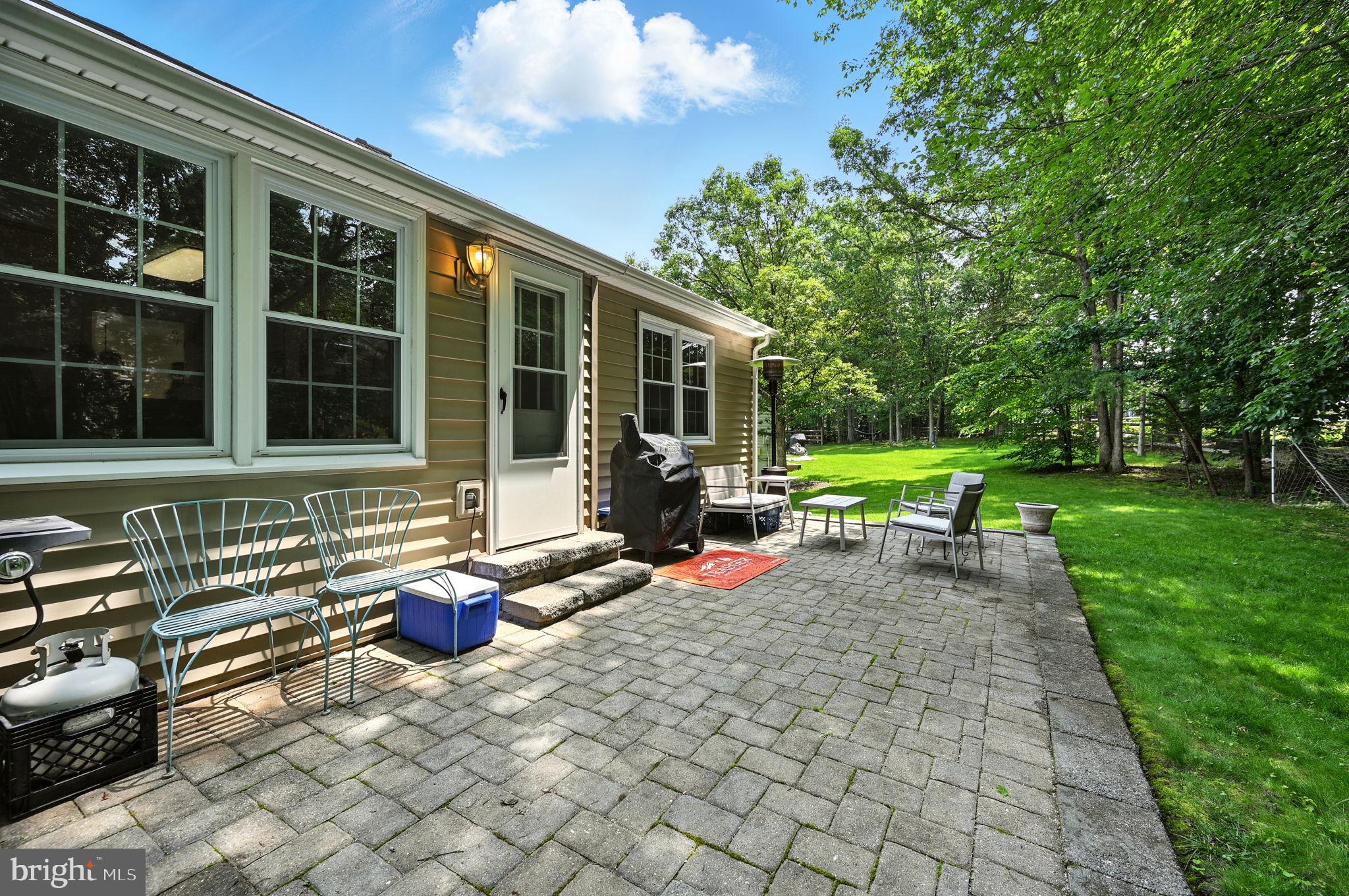 8923 Renshaw Court Springfield, VA 22153 - Photo 32 of 38 a view of a house with backyard sitting area and garden