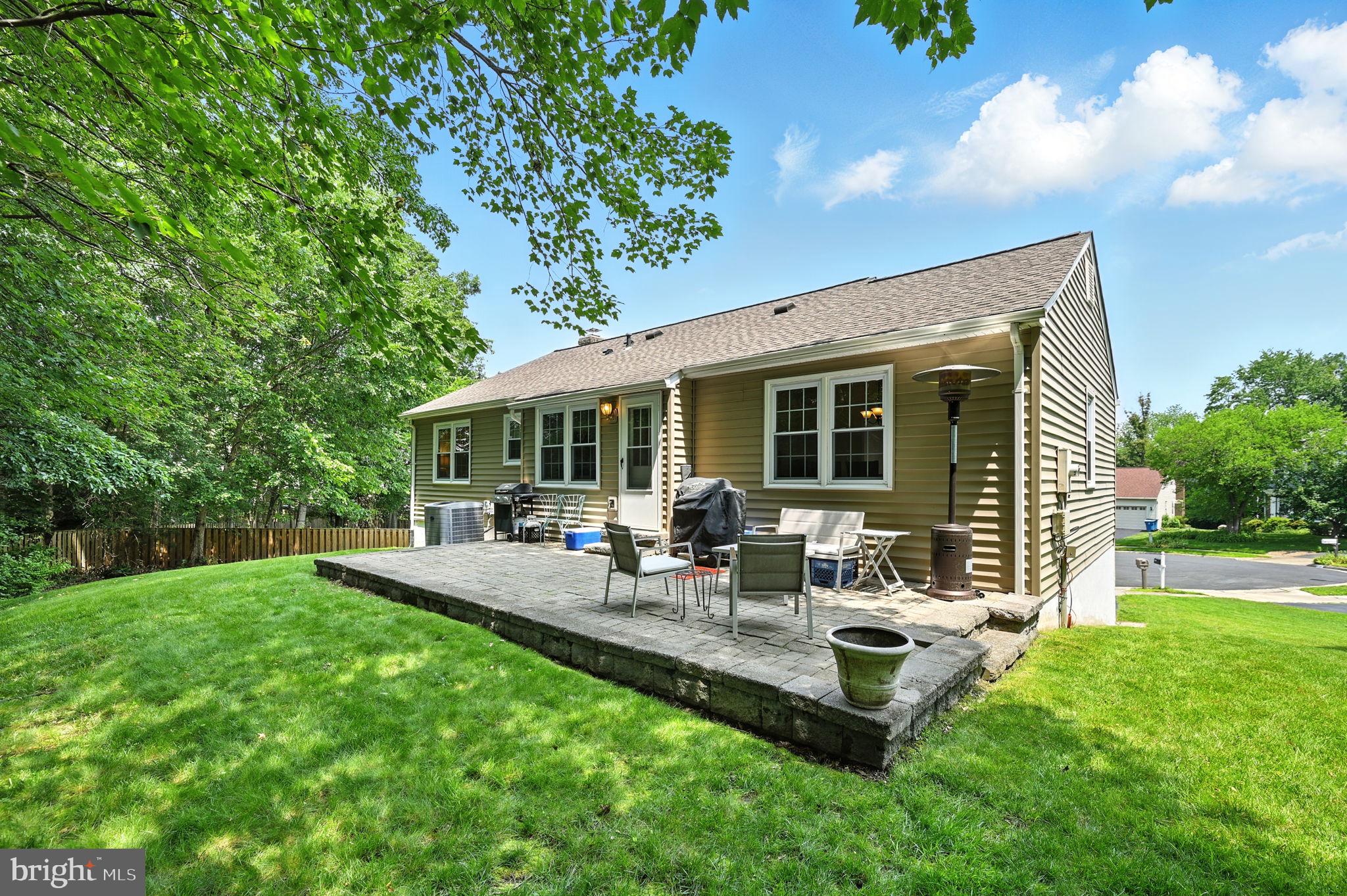 8923 Renshaw Court Springfield, VA 22153 - Photo 34 of 38 a view of a house with backyard sitting area and garden